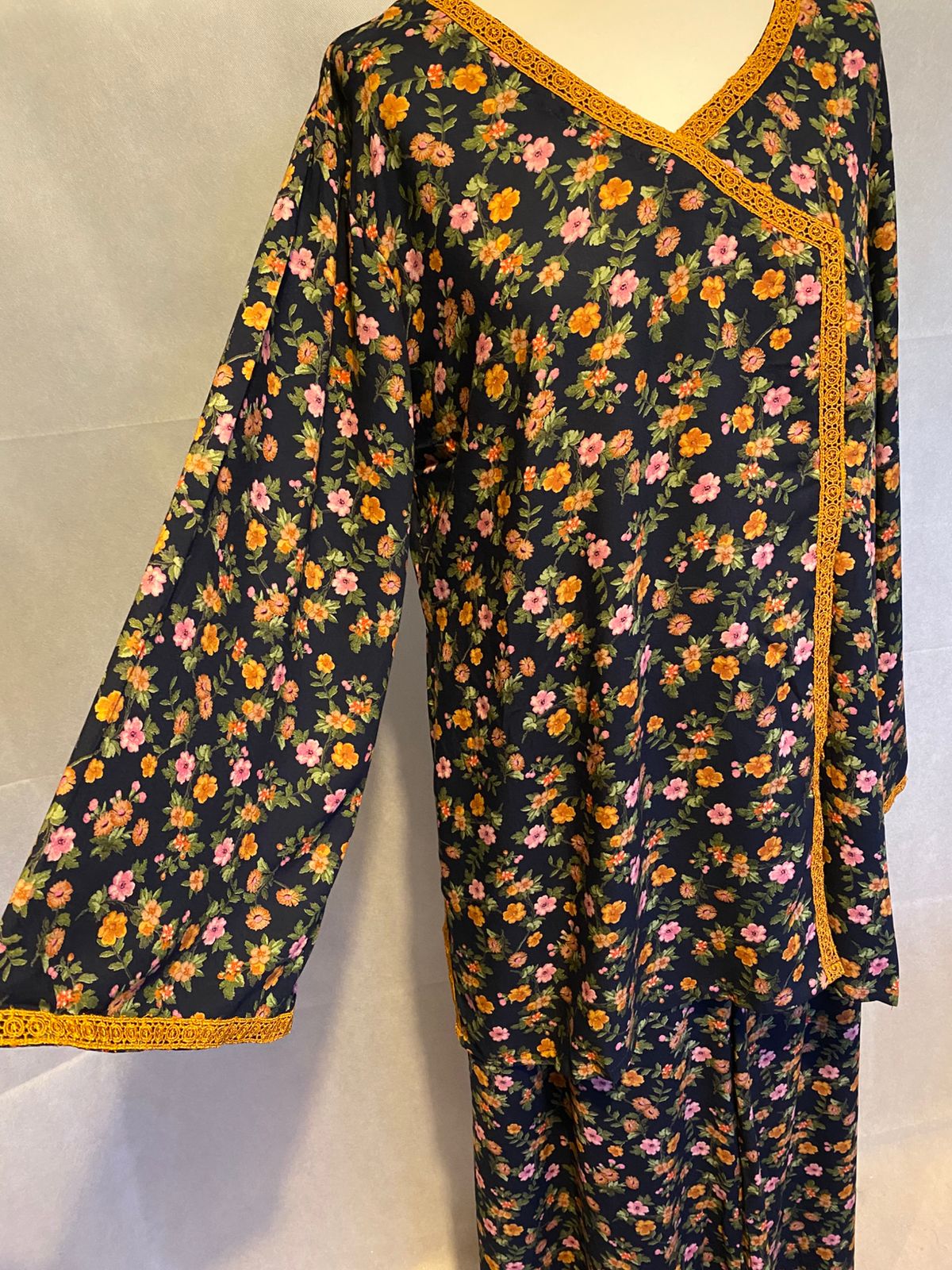 TRADITIONAL LOOKING FLORAL KURTA WITH MATCHING BOTTOMS.